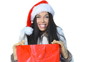 Sexy girl in santa claus hat with shopping bag
