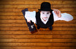 Portrait of the mime in a make-up on wood background