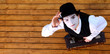 Portrait of the mime in a make-up on wood background