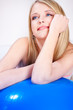 Attractive blue eye girl behind pilate ball