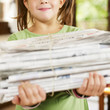 Photo: girl recycling newspapers girl recycling newspapers