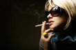 The beautiful girl smokes a cigarette The beautiful girl smokes a cigarette