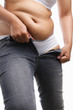 Fat woman trying to wear tight jeans