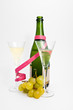 Two champagne glasses with grape  and providing