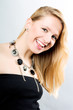 Portrait of funny young woman in black dress