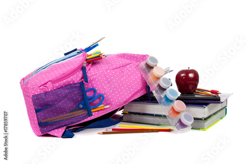 Photo: Backpack with school supplies on a white background Backpack with school supplies on a white background