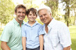 Grandfather With Father And Son In Park