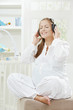 Pregnant woman listening music
