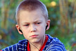 Teenager listens to music in headphones with a player