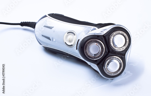 Photo: electric shaver on grey background electric shaver on grey background