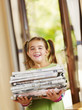 Photo: girl recycling newspapers girl recycling newspapers