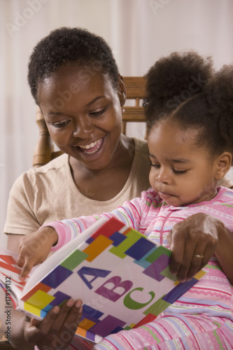Photo: African mother reading to daughter African mother reading to daughter