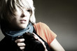 Young beautiful woman taking a photo with a digital camera
