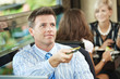 Businessman paying in cafe