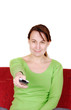 Young woman with remote control
