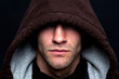 Evil looking hooded man
