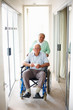 Senior couple at a hospital , man on the wheelchair