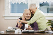 Senior couple paying bills