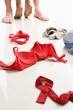 Foto: Couple having intercourse with red underwear on floor Couple having intercourse with red underwear on floor