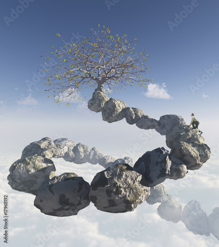 Foto: Man climbing rocks in sky towards tree Man climbing rocks in sky towards tree