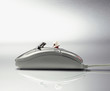 Digital composite of race car driver in computer mouse