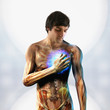 Anatomical man holding hand over glowing chest