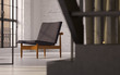 Modern Danish recliner in converted industrial loft interior Modern Danish recliner in converted industrial loft interior