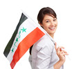 Lovely young woman with an Iraqi flag against white background
