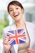 Cute young woman with United Kingdom´s flag