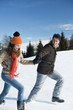 Couple running in winter scene