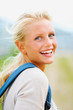 Portrait of a female college student laughing outdoors Portrait of a female college student laughing outdoors