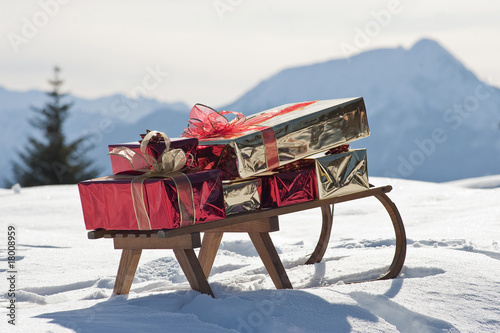 Photo: Sleigh with presents in snowy landscape Sleigh with presents in snowy landscape