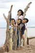 Four siblings by the lakeshore in summer