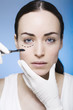 young woman with marks on her face gets surgery