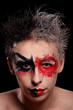 a man with colored painted face