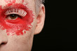 a man with colored painted face