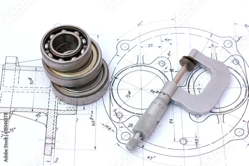 Photo: Three ball bearings over and over with micrometer on technical d Three ball bearings over and over with micrometer on technical d
