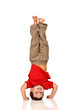Photo: child standing on his arms, yoga child standing on his arms, yoga