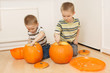 boys scooping pumpkins