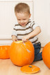 happy little boy with pumpkin