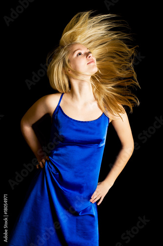 Photo: young blondie girl with spreading hair in the studio young blondie girl with spreading hair in the studio