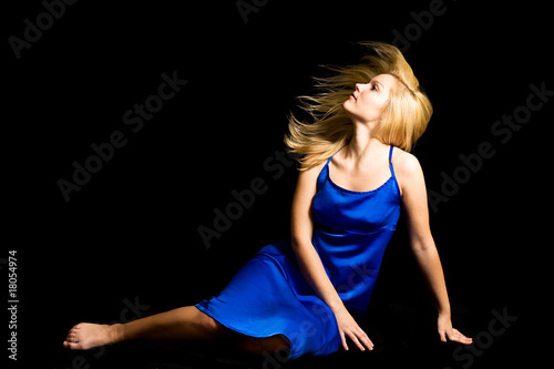 Photo: young blondie girl with spreading hair in the studio young blondie girl with spreading hair in the studio