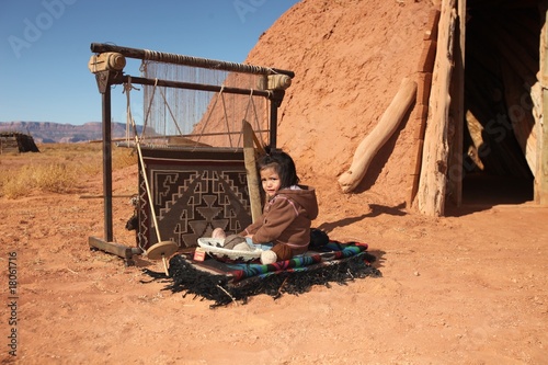 Photo: Navajo Child Sitting Next to Traditional Rug Making Tools Navajo Child Sitting Next to Traditional Rug Making Tools