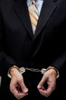 Business man in handcuffs