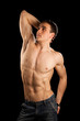 Sexy muscular man isolated on black