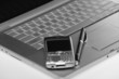 Laptop, cellphone and black pen