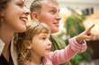 family with girl little with hand pointing finger forward family with girl little with hand pointing finger forward