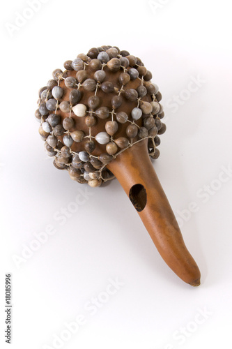 Photo: Calabash rattle on white background. Calabash rattle on white background.