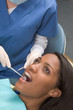 Photo: African-American woman and Caucasian dentist African-American woman and Caucasian dentist