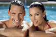 Beautiful Couple Relaxing In Swimming Pool With Perfect Smiles